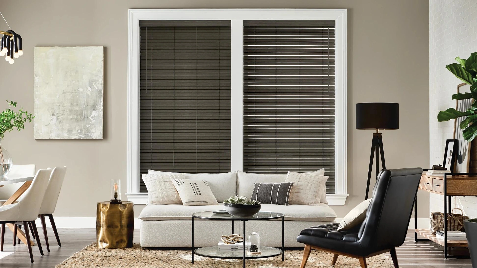 Dark Alta faux-wood blinds in a pale sitting room.