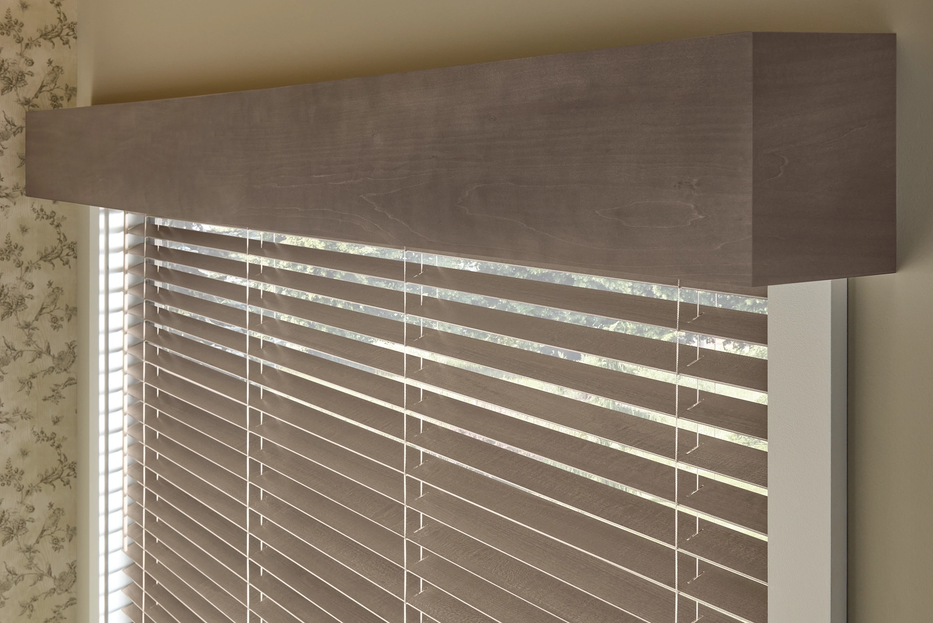 Close-up of Graber wood slats beneath a wood cornice.