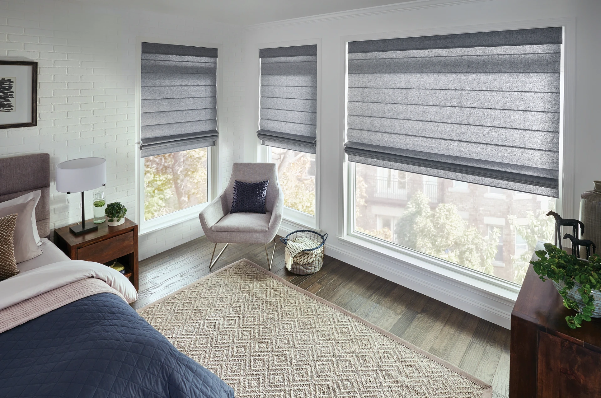Graber Classic Roman shades fitted to a room's windows.