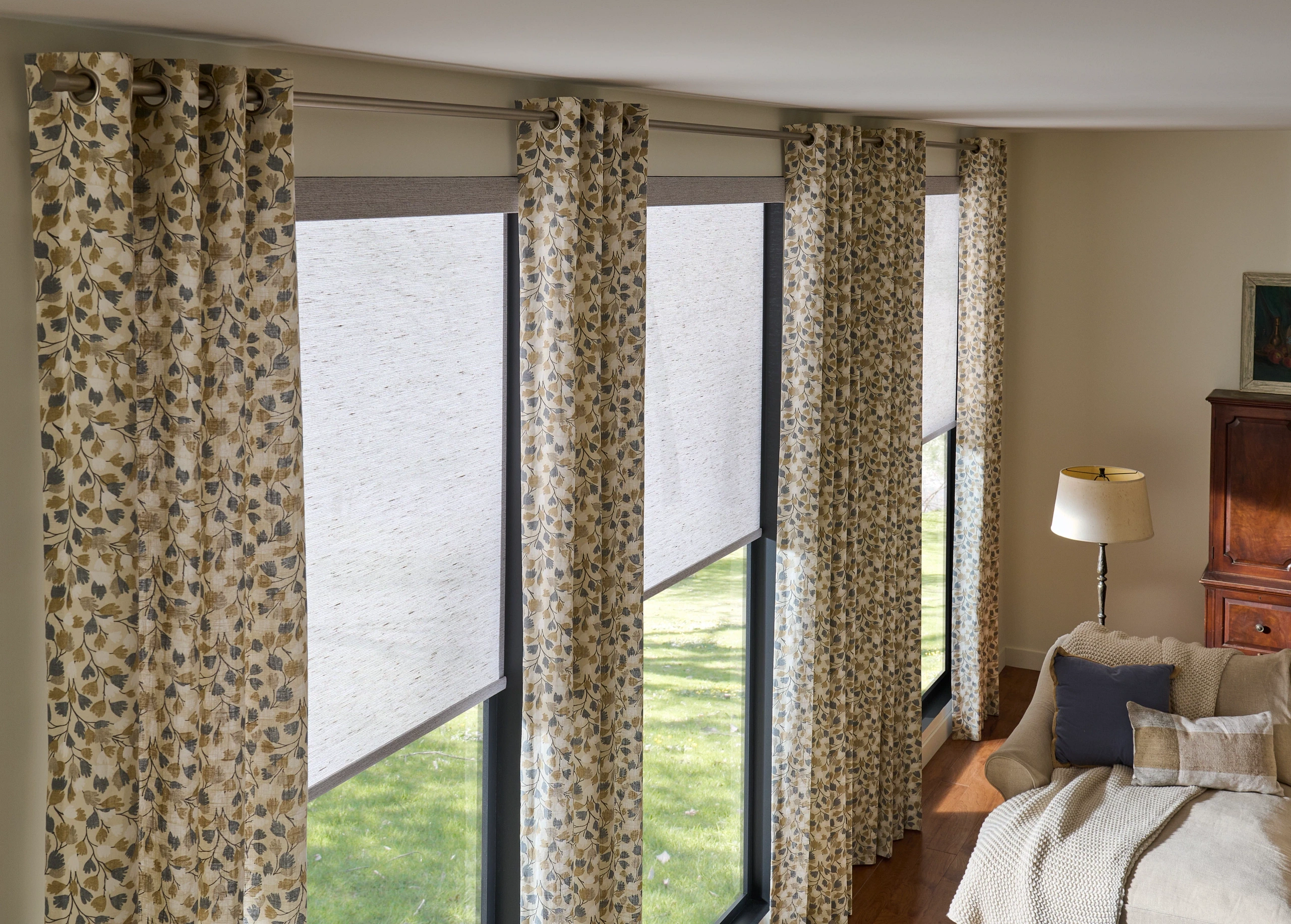 Blue cordless Graber roller shades in a home office.